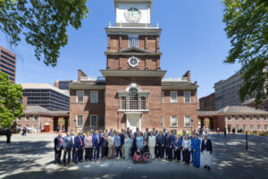 Members of the Pennsylvania State Senate stand in front of Independence Hall.